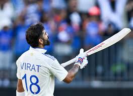 “Virat Kohli raising bat after scoring a century”